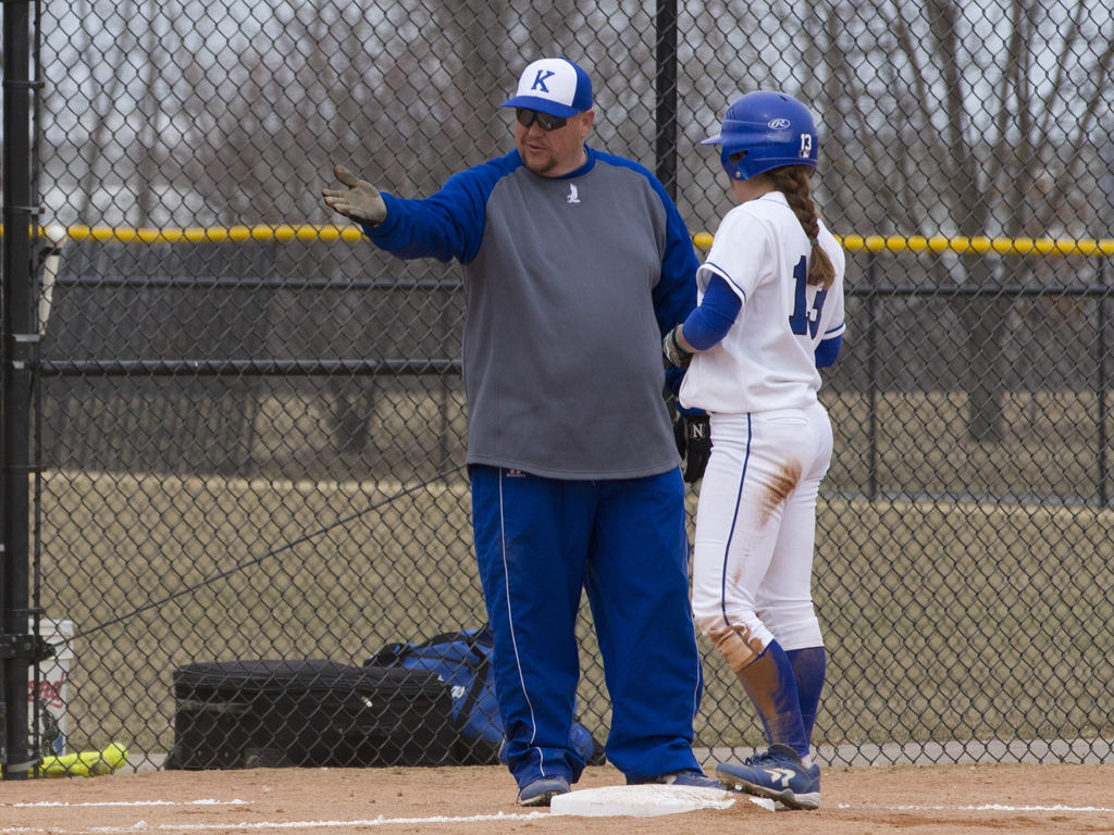 Head Coach Joe Yegge gives Shelby Crist some tips for running the bases