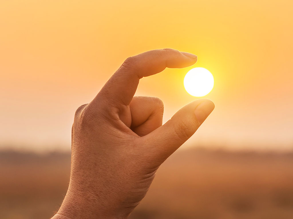 hand-holding-the-sun-featured