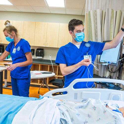 Nursing-Students-Setting-Up-IV