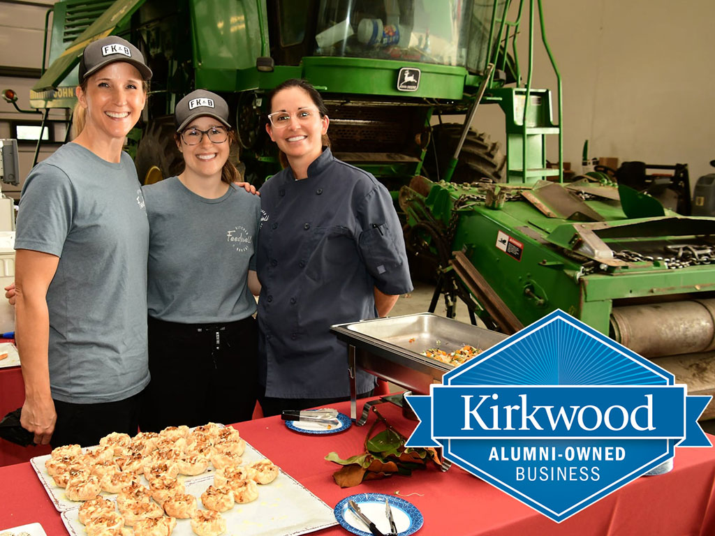 Feedwell-Employees-in-Front-of-Farm-Machinery