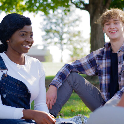 Students-Sitting-Under-a-Tree-Featured