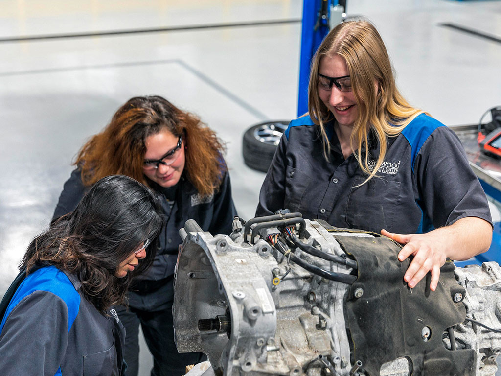 Female-Students-Working-on-a-Car-Featured