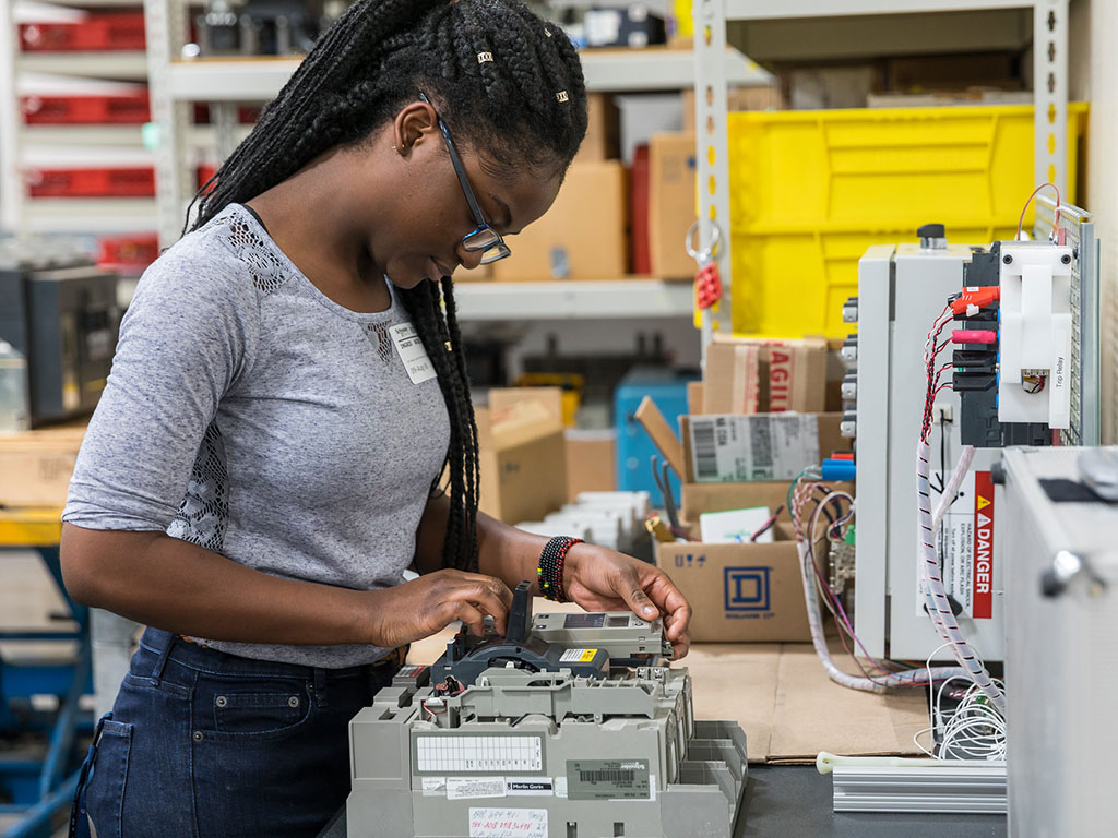 Young-Woman-Working-on-Electronics-Featured