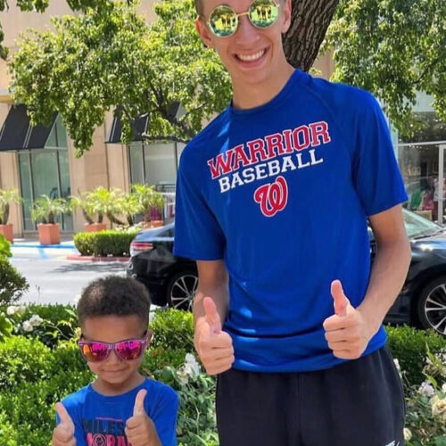 Isaac-Giving-Thumbs-Up-with-a-Kid-Featured