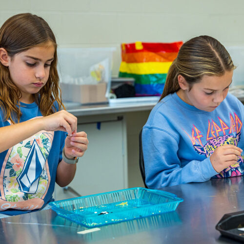 Two-KICK-Campers-Making-Bead-Necklaces-Featured
