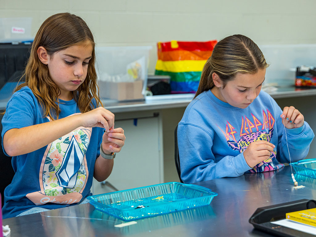 Two-KICK-Campers-Making-Bead-Necklaces-Featured