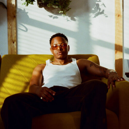 Alex-Duncan-Sitting-on-a-Couch-Featured