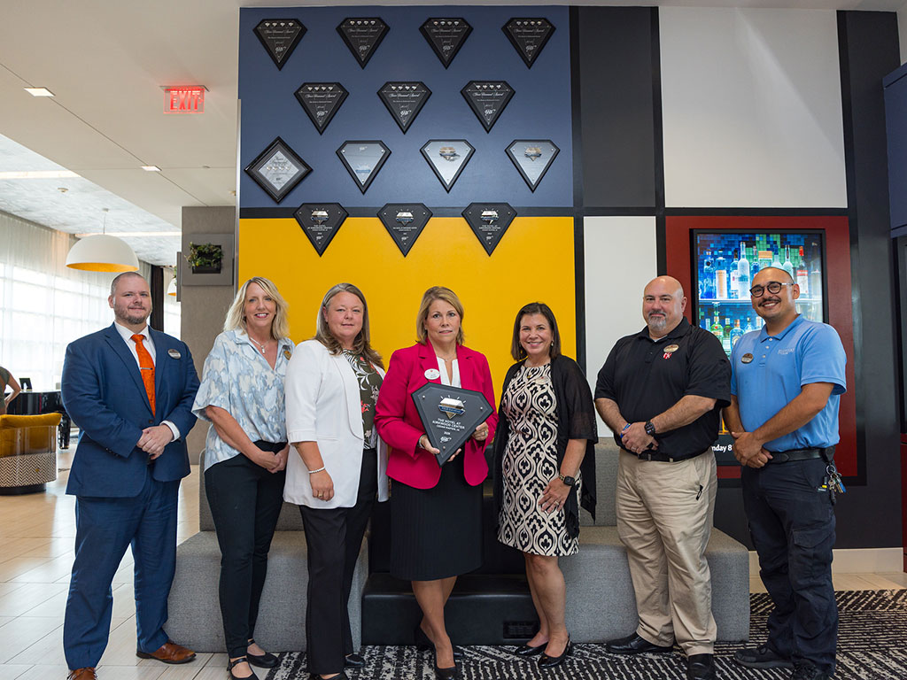 Hotel-Employees-with-Four-Diamond-Awards-in-the-Lobby-Featured