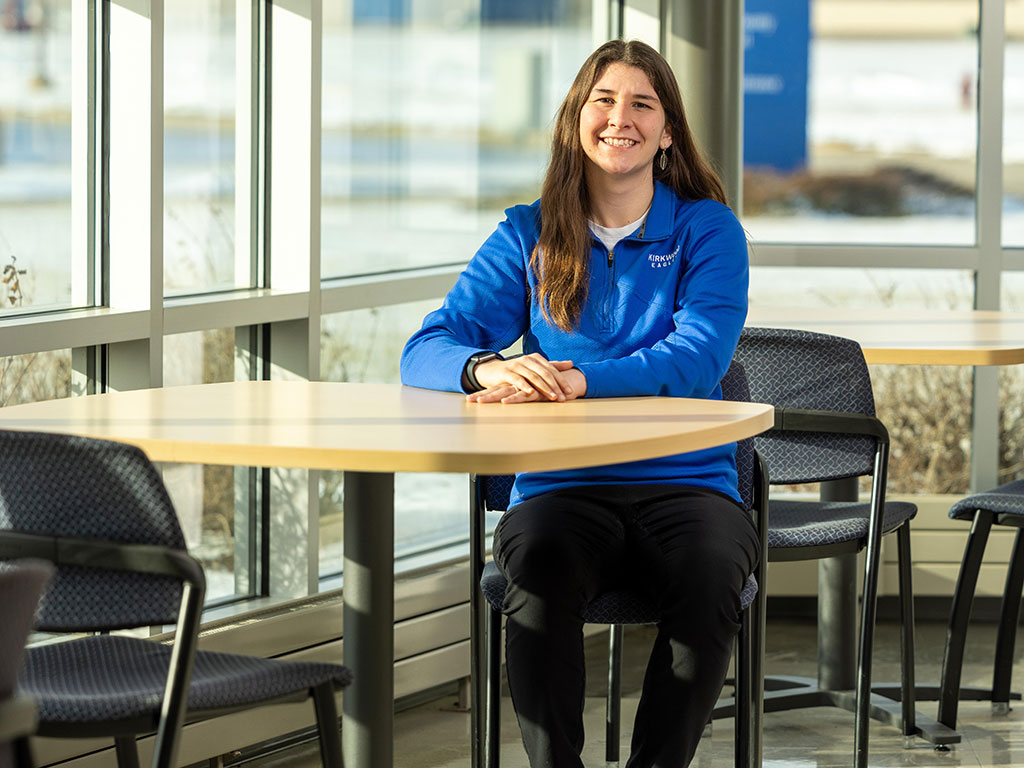 Megan-Stadtmueller-Sitting-at-a-Table-Featured
