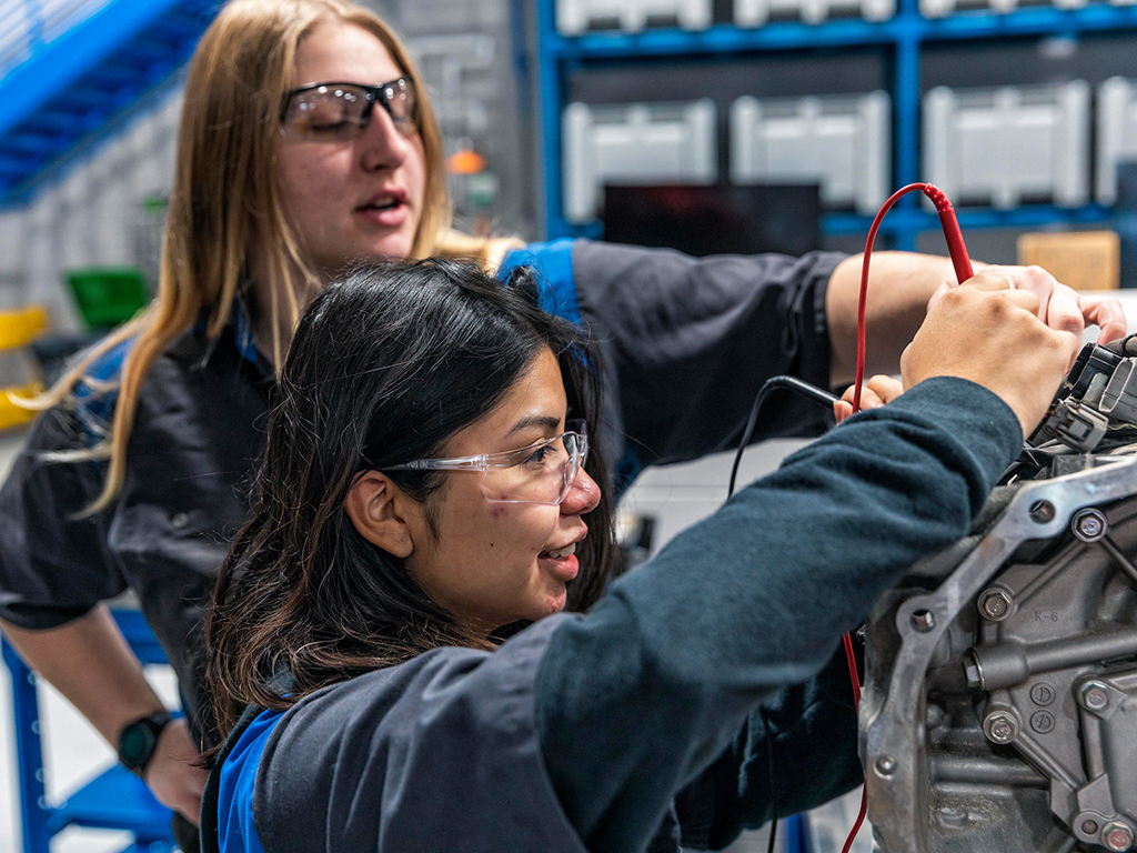 Automotive Students Work on a Car Featured